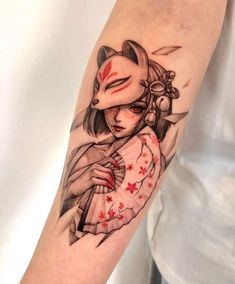 a woman's arm with a geisha tattoo design on the left upper arm