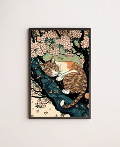 a cat sleeping in a tree with flowers on it's branches, framed in black frame