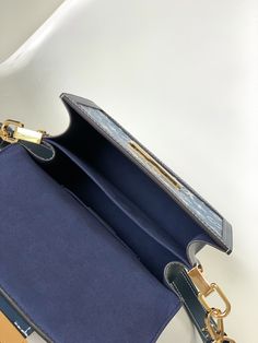 This Dauphine small handbag is made of classic logo denim to show the relentless pursuit of sustainable denim craftsmanship, and convey the atmosphere of neo-retro together with the cow leather trim. An optional chain and interior compartment add functional details.

Dimensions: 20 x 15 x 9 cm (length x height x width) Rectangular Monogram Canvas Flap Bag For Everyday Use, Everyday Rectangular Monogram Canvas Flap Bag, High-end Blue Satchel For Everyday Use, High-end Blue Satchel For Everyday, High-end Blue Box Bag With Detachable Handle, High-end Blue Box Bag For Everyday Use, High-end Blue Box Bag For Daily Use, Classic Blue Top Handle Box Bag, Luxury Blue Flap Bag With Detachable Handle