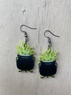 Sisters! We've been gone 300 years! Length 1.25" Drop length 2.25" Width 1" Material: acrylic Location: earlobe Agatha - E184 Thanks for shopping at Minty Mountain and for supporting small business! Made in the USA. Sanderson Sisters Earrings, Green Halloween Earrings, Green Novelty Earrings For Halloween, Sandworm Earrings, Quirky Halloween Earrings, Winifred Sanderson, Halloween Jewelry, Labour Day, Jewelry Earrings Dangle