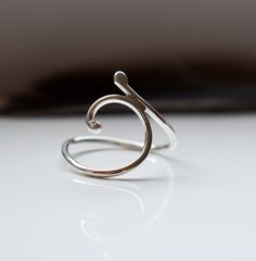 My sterling silver Flow ring is handmade to order, here in my jewellery studio in Scotland. I use recycled 925 sterling silver to create all my silver jewellery. The ring wraps its self round the finger, in a natural organic style. A beautiful reminder to stay In The Flow. Made from solid, recycled sterling silver, 1.3mm in diameter. Once fabricated, I hand polish the ring and tumble it, which shines it up further and strengthens the silver, making it solid and durable for every-day wear. Select Handmade Sterling Silver Jewelry With A Modern Twist, Modern Twist Sterling Silver Open Ring Jewelry, Modern Twist Open Ring In Sterling Silver, Minimalist Sterling Silver Jewelry With Unique Design, Minimalist Sterling Silver Spiral Ring, Minimalist Spiral Sterling Silver Ring, Minimalist Hand Forged Sterling Silver Rings, Handmade Sterling Silver Spiral Rings, Spiral Stackable Sterling Silver Rings For Gift