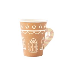 a paper cup with a gingerbread house on it