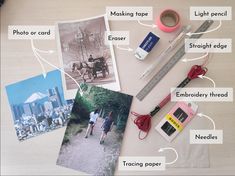 the contents of a travel photo laid out on a table with labels, tape, scissors and other items