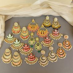 A pair of golden-toned Hand Painted Traditional Meenakari Earring for Saree.  Size & Other Details Material : Brass, Pearl, Meena work Shape : Flower Shaped Attire : Lehenga Choli, Salwar Suit, Kurti, Saree, Flared Dress FYI: Assorted designs will come depending on the stock available. 5 color left Shop more: https://www.etsy.com/shop/FashionCrabIndia/ Style Tip ---------------------------- Elevate your traditional outfits with our unique collection. Perfect for festivals. Care Tips ------------ Multicolor Meenakari Jhumkas Drop Earrings, Kundan Meenakari Earrings In Temple Jewelry Style, Kundan Chandbali Earrings In Temple Jewelry Style, Kundan Chandbali Temple Jewelry Earrings, Kundan Temple Jewelry Earrings For Festivals, Multicolor Meenakari Temple Jewelry Danglers, Traditional Multicolor Chandbali Hoop Earrings, Multicolor Traditional Hoop Earrings With Latkans, Temple Jewelry Kundan Earrings For Festivals