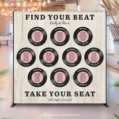 a wooden sign that says find your beat and take your seat with the names on it