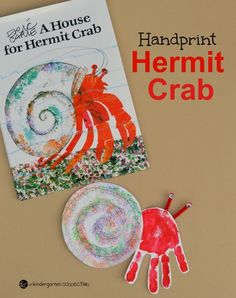 a paper plate with a handprinted crab next to a book about the house for hermit crab