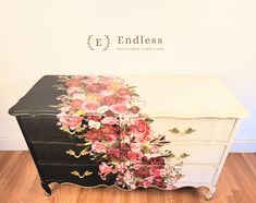 an old dresser with flowers painted on it