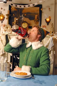 a man dressed as elf drinking from a bottle