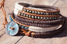 "Earthy and 100% Boho, this leather wrap will be your favorite.  The many textures and different stone types gives this one of a kind wrap a unique look. Made with off white hemp cord, waxed cotton thread, pyrite nuggets, beautiful teal Swarovski crystals, a petina blue cornflake button and gorgeous reddish brown leather. Size: 7 - 8 \" wrist  * two different loop sizes for size variation" Rustic Adjustable Wrap Bracelet, Rustic Adjustable Hand-wrapped Bracelet, Rustic Adjustable Hand Wrapped Bracelet, Handmade Bohemian Wrap Bracelet For Everyday, Bohemian Handmade Wrap Bracelet For Everyday, Hand-stitched Adjustable Bohemian Jewelry, Bohemian Handmade Wrap Bracelet, Bohemian Handmade Everyday Wrap Bracelet, Everyday Bohemian Handmade Wrap Bracelet