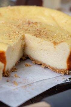 a close up of a cheesecake on a piece of paper