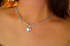 Chain is adjustable. (Not a real locket) Trendy Silver Chain Heart Jewelry, Heart-shaped Silver Chain Jewelry, Trendy Silver Heart Metal Necklace, Trendy Silver Metal Heart Necklace, Trendy Silver Heart Necklace, Trendy Silver Heart Necklace With Chunky Chain, Silver Metal Heart Choker Necklace, Silver Heart Choker Necklace With Chain, Silver Heart Necklace With Chunky Chain For Gifts