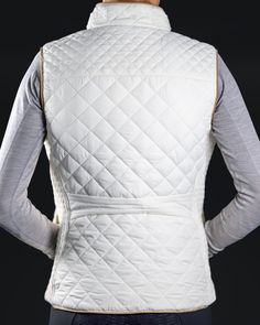 Luxurious quilted pattern with an elastic ribbed side panel. It's all in the details with this vest. Intricate detailing, elegant piping, heart cut out zippers, and monogram logo buttons. Elegant Piping Intricate Detailing Heart Zippers Zipper Ride, Heart Cut Out, Quilted Pattern, Vest White, Shopping App, Nice Leather, Monogram Logo, Vest Dress, Panel Siding