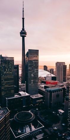 an aerial view of the city skyline at sunset