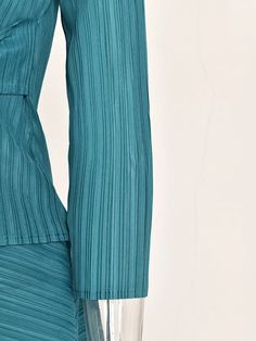 Step into effortless elegance with the Turquoise Casual Chic Pleated Set. Featuring a long sleeve top and an asymmetrical skirt, this set is designed for busy women who value style and comfort.  Perfect for any occasion, from casual outings to special events.  Why You Need It   Complete Set:  Includes a long sleeve top and an asymmetrical skirt.   Comfortable Fit:  Designed for all-day wear with an elastic waistband.   Authentic Japanese Pleated Fabric:  Luxurious and high-quality.   Feminine an Elegant Chic, Pleated Fabric, Asymmetrical Skirt, New Tops, Sweater Coats, Wide Leg Trousers, Exclusive Designs, Amazing Women, Casual Chic