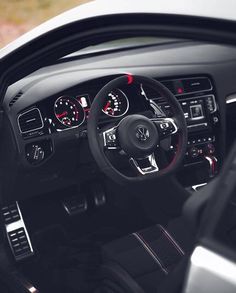 the interior of a car with dashboard lights and gauges