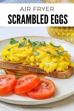 an egg and tomato sandwich on a plate with the words air fryer scrambled eggs above it