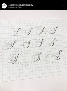 some type of calligraphy on a sheet of paper