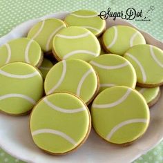 a white plate topped with green and white cookies