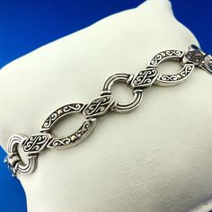 * Designer 18K White Gold Sterling Silver Scroll Oval Circle Link Toggle Bracelet * Length: 8-1/4" * Width: 1/2" * Clasp: Toggle * Weight: 22.3 g * Marked: 925 * 18K * Condition: Great, as pictured. * S1683    Exported By ExportYourStore :) Luxury Engraved Oval Link Jewelry, Elegant Gold Chain Bracelet With Sterling Silver Clasp, Elegant Sterling Silver Link Bracelet, Elegant Sterling Silver Formal Bracelet, Classic Engraved Sterling Silver Bracelet, Elegant Link Jewelry With Clasp, Elegant Formal Chain Bracelet, Elegant Sterling Silver Link Bracelet Adjustable, Elegant Engraved Oval Link Chain Bracelet