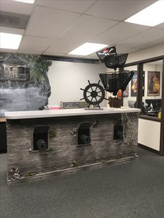 an office cubicle decorated with pirate themed decorations and decorating items on the wall