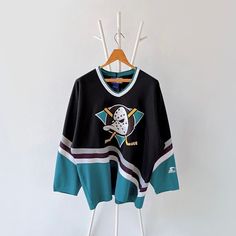 a hockey jersey hanging on a hanger