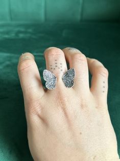 A intricate butterfly adjusts to sit atop your finger, detailed wings open up like they're about to take flight. The perfect gift for the butterfly lover in your life, and you don't need to know their size to get it for them. This ring looks beautiful on its own, or stacked with another. The best part, it's fully adjustable so it can fit you in all your seasons. No matter the cold or heat, it will always fit. This ring adjusts best for sizes 6-9, but can be adjusted if you need a larger or small Silver Butterfly Ring, Silver Signet Ring, Tanzanite Ring, Butterfly Ring, Silver Butterfly, Vintage Turquoise, The Butterfly, Dream Jewelry, Adjustable Ring