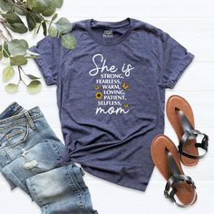 an american dad t - shirt next to some shoes and sandals on a white background