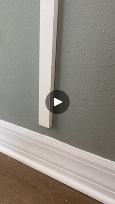 the corner of a room with a white door handle