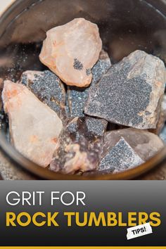 some rocks are in a metal bowl with the words grit for rock tumblers