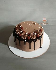 a cake with chocolate icing and sprinkles