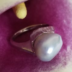 "* This beautiful pearl ring would be a wonderful gift to a bride on her wedding day, or perhaps the mother of the bride or groom! The silvery gray pearl is is unique and beautful, giving this ring tons of understated charm and elegance. This ring is very sturdy and well-made, and it shows! * This piece weighs 6.7 grams, and is stamped \"14K\" inside the shank. The pearls measure approximately 12.6 mm x 12.9 mm This ring is a US size 7. Please message us about sizing options prior to purchase! * Modern Pearl Wedding Ring, Silver Akoya Pearl Ring For Anniversary, Silver Akoya Pearl Drop Ring, Silver Akoya Pearl Ring With Pearl Drop, Unique White Gold Pearl Ring For Formal Occasions, Silver High Luster Pearl Ring For Anniversary, Luxury Silver Pearl Ring As A Gift, Modern Wedding Pearl Ring In Sterling Silver, Silver Pearl Ring With High Luster For Gift