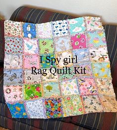 a couch with a quilt on it that says, i spy girl rag quilt kit