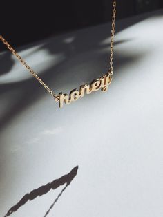 Sweet like HONEY... this lil' cutie is hand finished in our custom script font. *Also shown with a diamond and sapphire detail - contact us about adding a stone accent to this piece! Want to personalize a necklace with your own word? Shop our customized necklaces! Sweet Like Honey, Streetwear Aesthetic, Cottagecore Aesthetic, Script Font, Custom Necklace, Name Necklace, Gold Vermeil, Arrow Necklace, Jewelry Accessories