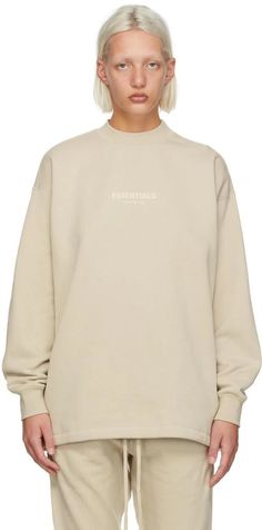 Fear of God ESSENTIALS.Beige Relaxed Crewneck Sweatshirt.Long sleeve cotton-blend fleece sweatshirt in beige. Logo flocked in off-white at front..· Rib knit crewneck collar, cuffs, and hem.· Rubberized logo patch at back collar.Please note that this item may not be shipped within the EU..Supplier color: Wheat.80% cotton, 20% polyester..Made in China..221161F098011 Beige Crewneck, Beige Sweatshirt, Crewneck Sweatshirt Women, Fear Of God Essentials, Fear Of God, Women Essentials, Knit Crewneck, Sweaters Crewneck, Fleece Sweatshirt