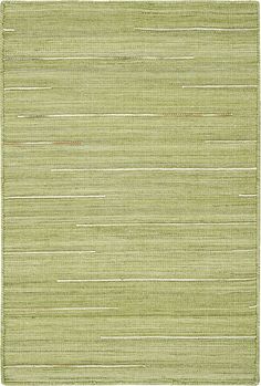 a green rug with white lines on it