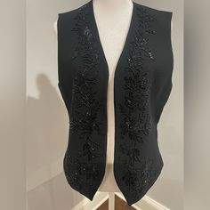 Excellent Condition Never Worn Beautiful Beaded Vest. Black Embellished Fitted Outerwear, Elegant Embellished Black Outerwear, Black Embellished Evening Outerwear, Elegant Black Embellished Outerwear, Beaded Fitted Outerwear For Night Out, Black Beaded Winter Outerwear, Black Beaded Outerwear For Spring, Spring Black Beaded Outerwear, Beaded Vest