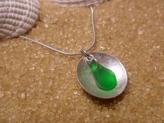 "Hand brushed sterling silver dome (1.5cm) within hangs a emerald green sea glass nugget . Linked to 18\"sterling silver snake chain. £34.00" Main 1, Sea Glass Pendant, Silver Snake Chain, Green Sea, Snake Chain, Glass Pendant, Glass Pendants, Sea Glass, Emerald Green