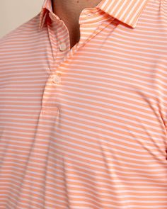 Classic stripes blend with modern coastal colors to craft a casual but considered polo. With striking color as far as the eye can see, the classic three-button placket, self-collar, and drop-tail hem construction keep it feeling sophisticated. Designed from quick-dry material with brrr° cooling technology, you'll feel ready for whatever the tide washes in. Style: 10621 Classic Striped Polo Shirt, Summer Collared Polo Shirt With Horizontal Stripes, Classic Striped Collared Polo Shirt, Casual Summer Polo Shirt With Horizontal Stripes, Striped Relaxed Fit Polo Shirt For Summer, Summer Striped Relaxed Fit Polo Shirt, Casual Striped Polo Shirt For Golf, Striped Relaxed Fit Polo Shirt, Striped Relaxed Fit Collared Polo Shirt