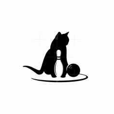 a black and white image of a cat with a bowling ball in its paws on the ground