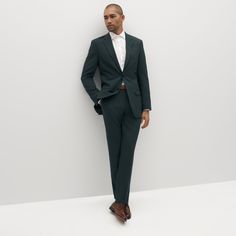 Take your style off the beaten path with our dark forest green suit. Sure to keep you sharp, our dark green suit is a rich, earthy shade, perfect for day or night, city or country, and everything in between. Combine this unique, dark hunter color with our deluxe stretch-fit fabric, and you’ve got the perfect suit for all-day comfort and style. Fitted Green Sport Coat For Semi-formal Occasions, Green Suits With Welt Pockets For Semi-formal Occasions, Semi-formal Green Suits With Welt Pockets, Tailored Green Winter Suit, Green Semi-formal Suits With Welt Pockets, Formal Green Outerwear With Suit Collar, Green Formal Outerwear With Suit Collar, Green Formal Suit With Welt Pockets, Classic Green Business Casual Suits