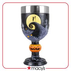 a wine glass decorated with an image of a jack - o'- lantern