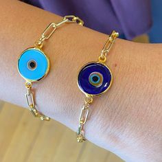 Shades of Blue Protective Eye Bracelet. Gold plated chain w/gold filled clasp. It is known, that the evil eye Talismans are created to protect against the evil eye, which is a curse believed to be cast by a malevolent glare, which can cause misfortune or injury. Please let us know which is your favorite "EYE" when checking out in the "notes" section. Buy your Evil Eye Bracelet today and feel protected! All Jewelry SOLD separately! Blue Resizable Evil Eye Bracelet, Metal Evil Eye Bracelet, Blue Metal Evil Eye Bracelet, Adjustable Blue Evil Eye Bracelet, Nickel Free, Bohemian Blue Evil Eye Bracelet Hand-strung, Protective Eye, Eye Bracelet, Evil Eye Bracelet, Jewelry Lookbook