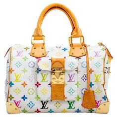 The Japanese pop artist Takashi Murakami worked to revamp the traditional monogram toile and give it a splash of colour. He created a new vibrant canvas with 33 colours on white canvas as seen in this iconic speedy bag. This bag is made with white canvas with multicolour monogram print and features brass hardware, natural leather finishes, plated corners for protection, yellow topstitching and top zip closure. Red alcantara interior lining. COLOR: White MATERIAL: Coated canvas DATE CODE: SP0033 Louis Vuitton Murakami, Traditional Monogram, Speedy Bag, Coordinates Outfits, Louis Vuitton Multicolor, Expensive Handbags, Takashi Murakami, Japanese Pop, Handbag Heaven