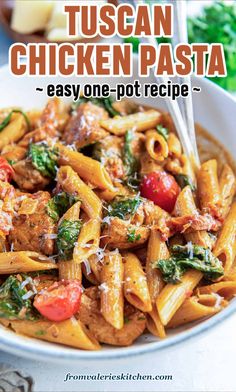 a white bowl filled with pasta and spinach