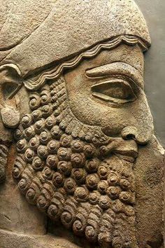 an ancient statue with a beard and mustache