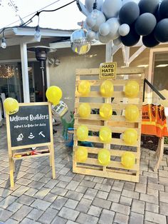 some balloons are on display in front of a store