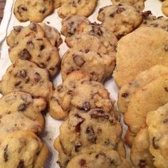 chocolate chip cookies are lined up on a table