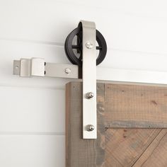 a close up of a door handle on a barn door