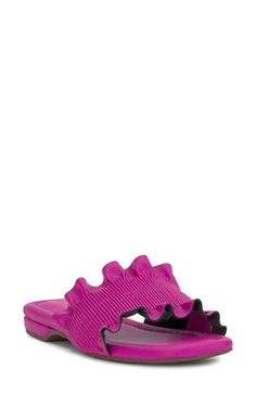 Frothy ruffles add eye-caching charm to the vamp of a stylish slide sandal fashioned with an angular square toe. Synthetic upper and lining/rubber sole Imported Summer Party Sandals With Ruffles, Summer Ruffled Open Toe Sandals, Summer Ruffle Open Toe Sandals, Pink Adjustable Synthetic Slides, Pink Slip-on Slides With Rubber Sole, Beach Slide Jelly Sandals, Synthetic, Pink Synthetic Slip-on Jelly Sandals, Pink Textured Sole Slip-on Sandals, The Vamp