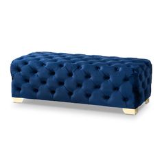 a blue bench with gold legs and buttons on the back, in front of a white background